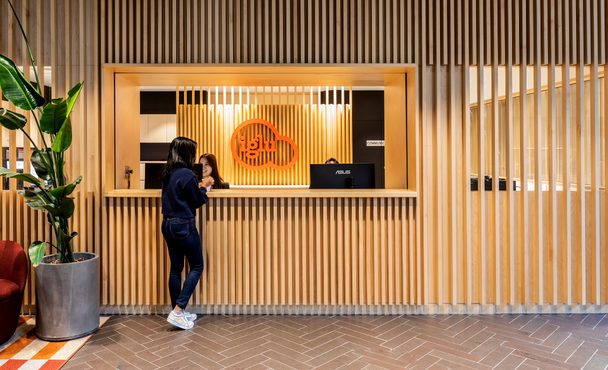 resident standing at student accommodation front desk